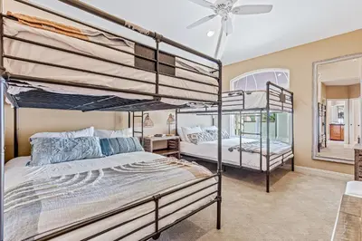a bedroom with two bunk beds and a window at Rivo of Dreams in Long Beach