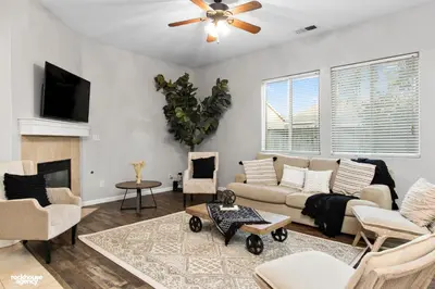 a living room with a couch and a fireplace at NorthWest Farmhouse in Bakersfield