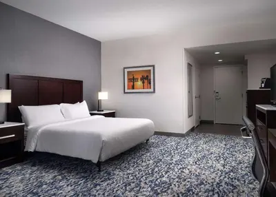a hotel room with a large bed and a television at Hilton Garden Inn Los Angeles/Redondo Beach in Redondo Beach