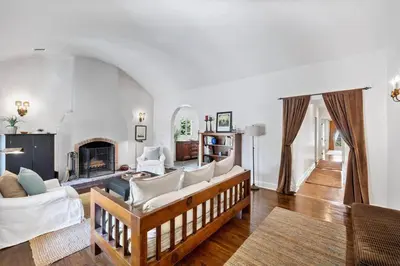 a living room with a couch and a fireplace at Secluded 4BR Spanish Oasis in the Heart of LA in Los Angeles