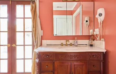 a bathroom with a sink and a mirror at Hollywood Home in Los Angeles