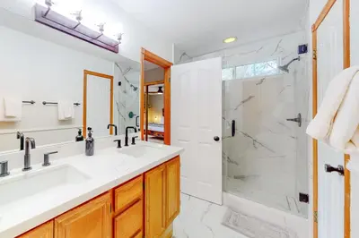 a bathroom with a sink and a shower at Sequoia Serenity in Lake Arrowhead