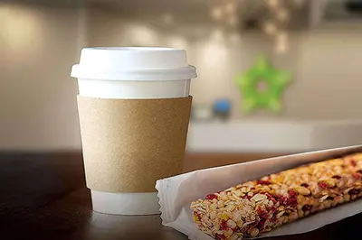 a cup of coffee and a hot dog on a table at Extended Stay America Suites - Norco in Norco
