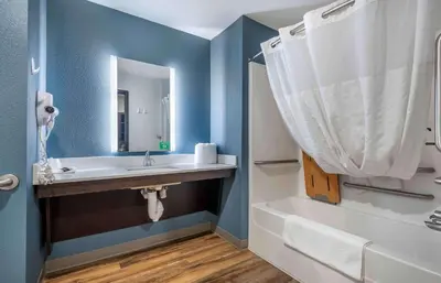 a bathroom with a sink and a tub and a mirror at Extended Stay America Suites - Norco in Norco