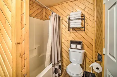 a wooden bathroom with a toilet and a shower at Grizzly Pine Cottage - Walk to Ski Beach Park! in Big Bear Lake