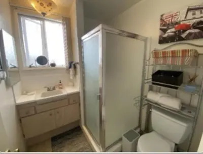a bathroom with a shower and a toilet and a sink at Stay in Beverly Hills - Private Bedroom & Bath for female only - near Beverly Center, Cedars Sinai Hospital, The Grove in Los Angeles