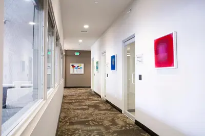 a corridor of a hospital hallway with a hallway at Redac Gateway Hotel Torrance in Torrance