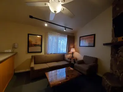 a living room with a couch and a table at GetAways at Snow Lake Lodge in Big Bear Lake