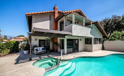 a house with a swimming pool in front of a house at Peaceful Private Retreat In The Heart Of Town in Redlands