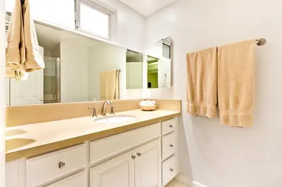 a bathroom with a sink and a mirror at Beautiful Views - Sand Section of Manhattan Beach 2 Bed/2 Bath in Manhattan Beach