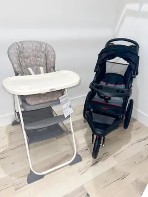 a stroller sitting next to a table and a chair at Huge Family Home Near Disneyland & SoCal Beaches in Midway City