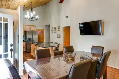 a kitchen and dining room with a table and chairs at Pine Mountain Club Home with Beautiful View! in Frazier Park
