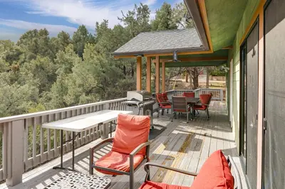 a deck with a table and chairs and a grill at Pine Mountain Club Home with Beautiful View! in Frazier Park