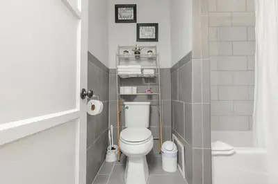 a small bathroom with a toilet and a shower at Cool and Cozy Pad Close to Everything in Los Angeles