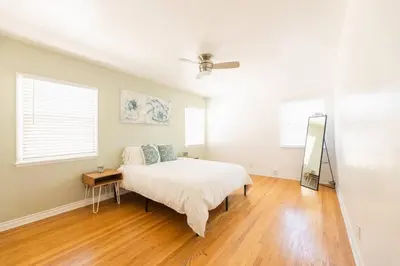 a bedroom with a bed and a ceiling fan at Inviting Home in Historic Leimert Park in Los Angeles