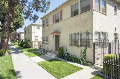 a house with a fence in front of it at Spring Charmer In The Heart Of The City in Los Angeles