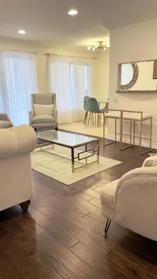 a living room with couches and a coffee table at Luxury 2-Bedroom Condo in Studio City in Los Angeles