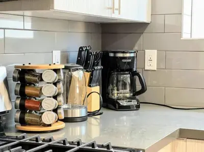 a kitchen counter with a coffee maker on it at 4BR Townhouse in KoreaTown in Los Angeles