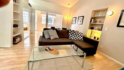 a living room with a couch and a glass table at Echo Park Hills - Walk to Dodger Stadium - Near DTLA SoFi in Los Angeles
