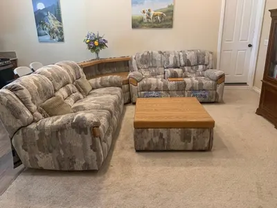 two couches and a coffee table in a living room at High End Triplex with Pool in Riverside