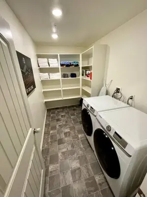 a laundry room with a washer and dryer in it at Spacious Modern Home in Sierra Lakes Fontana in Fontana