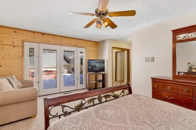 a bedroom with a bed and a ceiling fan at Crestwood Summit #2119 by Big Bear Vacations in Big Bear Lake