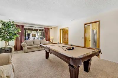 a living room with a pool table in it at Crestwood Summit #2119 by Big Bear Vacations in Big Bear Lake