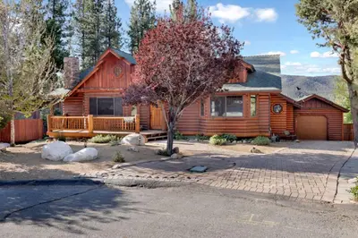 a log cabin with a porch and a driveway at The Alps Lodge #2142 by Big Bear Vacations in Big Bear Lake