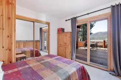 a bedroom with two beds and a balcony at The Alps Lodge #2142 by Big Bear Vacations in Big Bear Lake