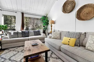 a living room with a couch and a table at Switzerland Slopes #2125 by Big Bear Vacations in Big Bear Lake
