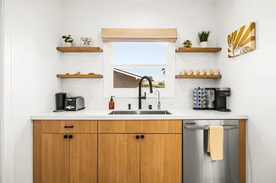 a kitchen with a sink and a window at Mid-Town Escape in Ventura