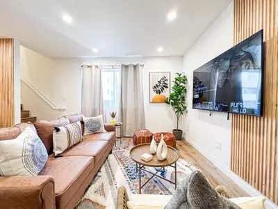 a living room with a couch and a tv at Comfy 2-bedroom home in Hollywood in Los Angeles