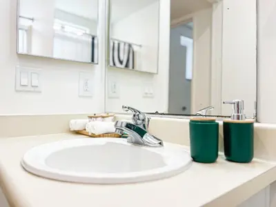 a bathroom counter with a sink and a mirror at Comfy 2-bedroom home in Hollywood in Los Angeles