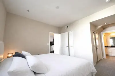 a bedroom with a large white bed with white pillows at Luxury Residence Loft 3 Beds with Pool and Gym in Los Angeles