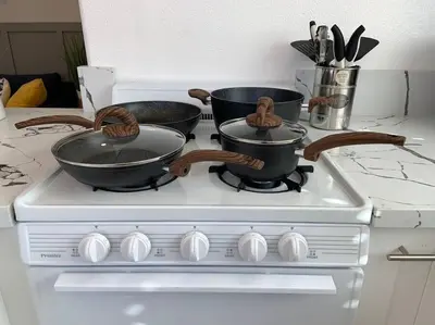 two pans sitting on top of a stove at King Garden Suite - 10 mins to Beach and LAX in Gardena