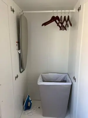 a bathroom with a trash can and a refrigerator at King Garden Suite - 10 mins to Beach and LAX in Gardena