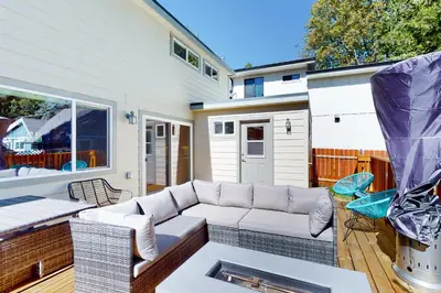 a living room with a couch on a patio at Hemlock Haven in Lake Arrowhead