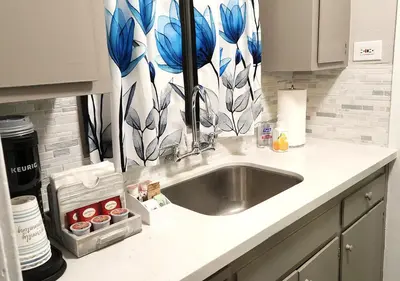 a kitchen counter with a sink in a kitchen at Beautiful Guesthouse, Sleeps 4 - Kitchen, Private Laundry, AC, Parking, 65' TV, Close to Stores, Restaurants & Beach in Long Beach