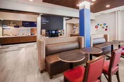 a restaurant with two tables and chairs and a counter at Holiday Inn Express & Suites - Glendale Downtown in Glendale