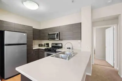 a kitchen with a sink and a refrigerator at COZY 2BR/2BA ! 5MINtoDisney ! AngelStadium!HondaCenter in Anaheim