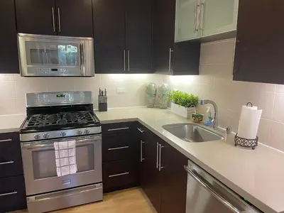 a kitchen with a stove and a sink at Super-Cute 2/2 apartment in Santa Monica with free parking in Los Angeles