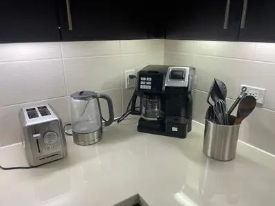 a kitchen counter with a coffee maker and appliances on it at Super-Cute 2/2 apartment in Santa Monica with free parking in Los Angeles