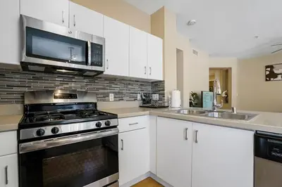 a kitchen with a stove and a microwave at Luxury 2BR/2BA!5Min to Disney! Angelstadium! HondaCenter. in Anaheim