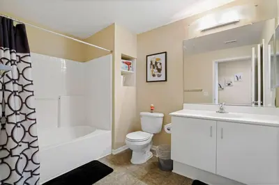 a bathroom with a toilet and a sink and a shower at Luxury 2BR/2BA!5Min to Disney! Angelstadium! HondaCenter. in Anaheim