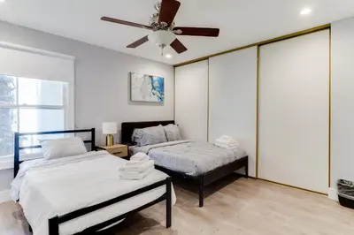 a bedroom with two beds and a ceiling fan at 4 Bedroom West Hills Charmer with Pool in West Hills