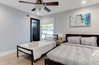 a bedroom with two beds and a ceiling fan at 4 Bedroom West Hills Charmer with Pool in West Hills