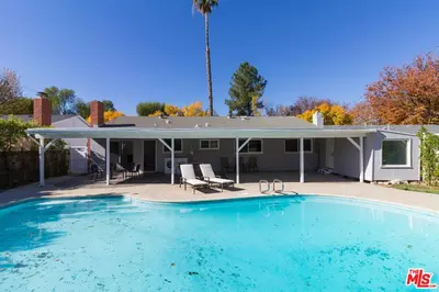 a large swimming pool in front of a house at 4 Bedroom West Hills Charmer with Pool in West Hills