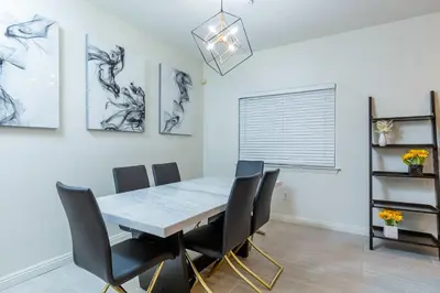 a dining room with a table and chairs at Newly Remodeled 5B4B 2 mile from the Rose Parade in Pasadena