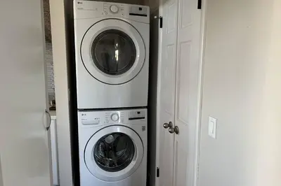 a washing machine and a washer and dryer in a room at Hollywood Hideaway in Los Angeles