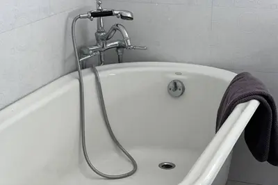 a bath tub with a faucet in a bathroom at Hollywood Hideaway in Los Angeles